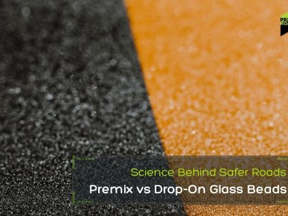 Close-up of textured black and yellow surfaces with a text overlay about road safety. The caption reads, "Premix vs Drop-On Glass Beads," suggesting a comparison.